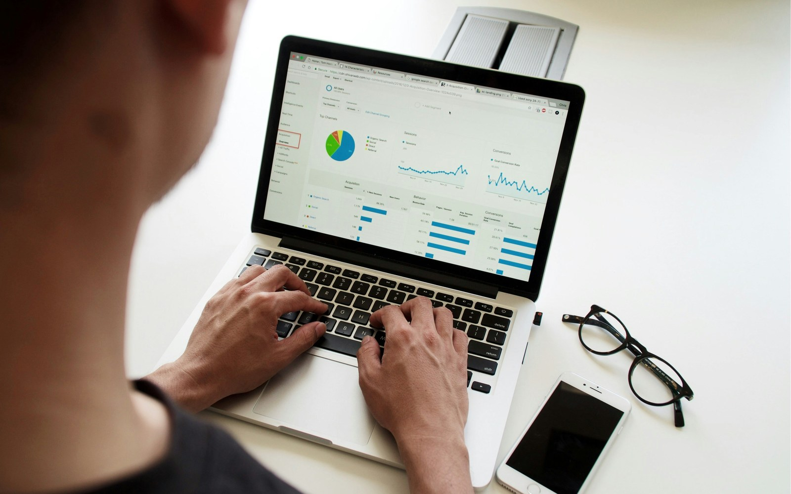 Creator reviewing brand deal analytics and content workflow on a laptop